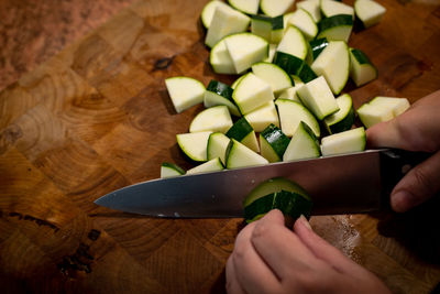 High angle view of person preparing food on cutting board