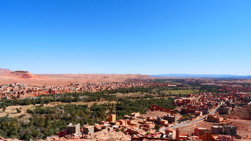 High angle shot of townscape against clear blue sky