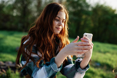 Young woman using mobile phone