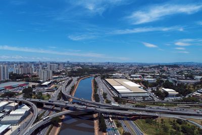 High angle view of street amidst buildings against sky