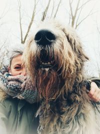 Woman with dog in snow