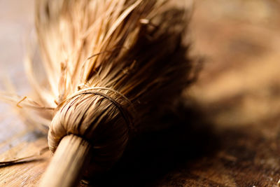 Close-up of broom on table