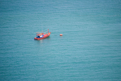 High angle view of boat sailing in sea