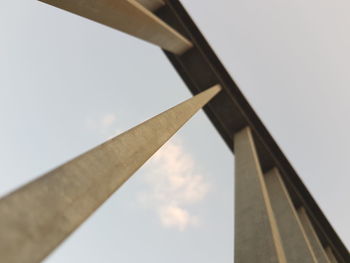 Low angle view of bridge against sky on sunny day