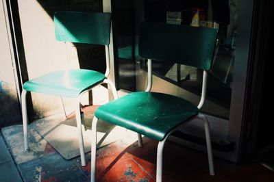 Empty chairs and table in restaurant