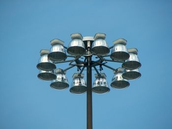 Low angle view of street light against clear blue sky