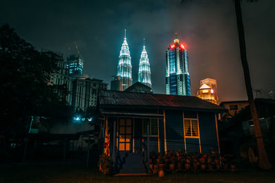 Low angle view of illuminated temple against sky at night