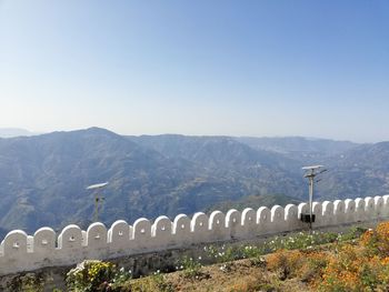 High angle view of mountain range against blue sky
