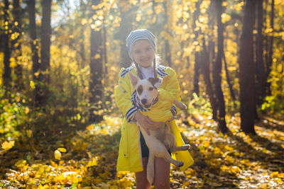 Full length of girl in forest during autumn