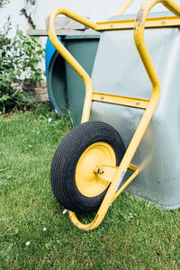 Close-up of yellow equipment on field