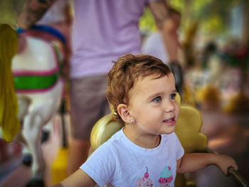 Portrait of cute girl looking away outdoors