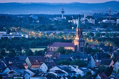 High angle view of illuminated buildings in city