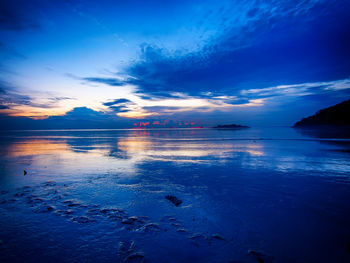 Scenic view of sea against sky at sunset