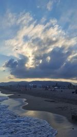 Scenic view of beach against sky during sunset