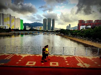 Rear view of woman standing on city street