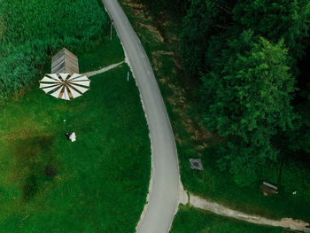 High angle view of umbrella on road