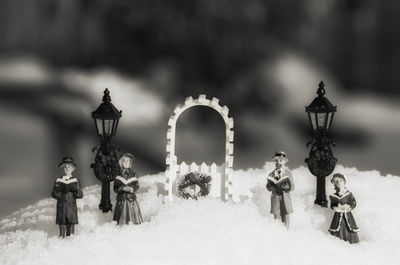 Close-up of figurines on snow