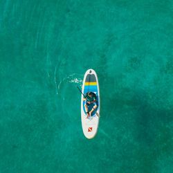 High angle view of person floating on swimming pool