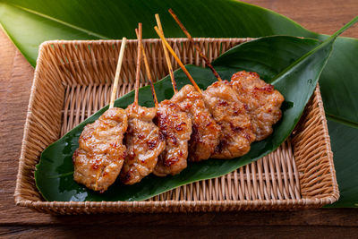 High angle view of meat on barbecue grill