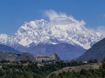 Scenic view of snowcapped mountains against sky