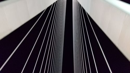 Low angle view of bridge against sky at night