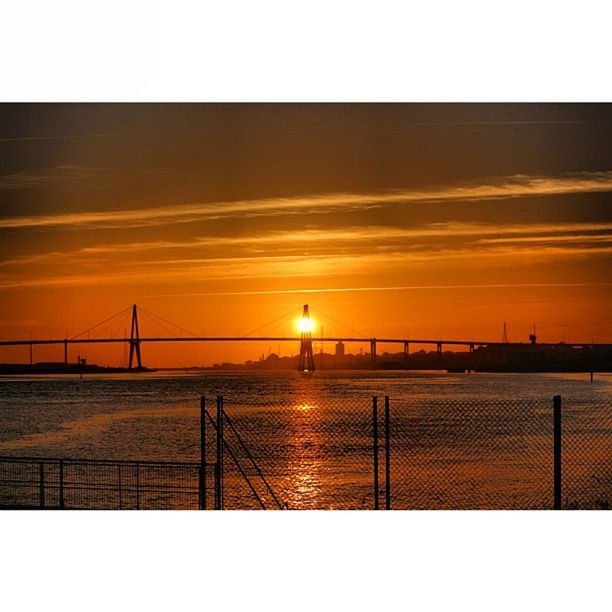 sunset, transfer print, connection, sun, bridge - man made structure, sky, built structure, silhouette, bridge, auto post production filter, architecture, railing, water, orange color, tranquility, scenics, tranquil scene, nature, sunlight, engineering