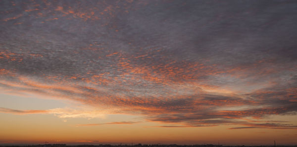 Scenic view of cloudy sky at sunset