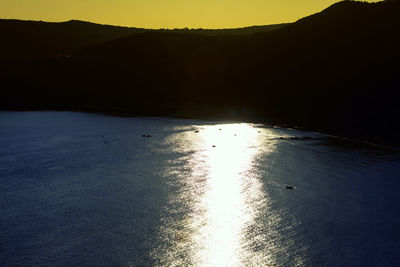 Scenic view of silhouette mountains against sky during sunset