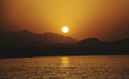 Scenic view of mountains at sunset