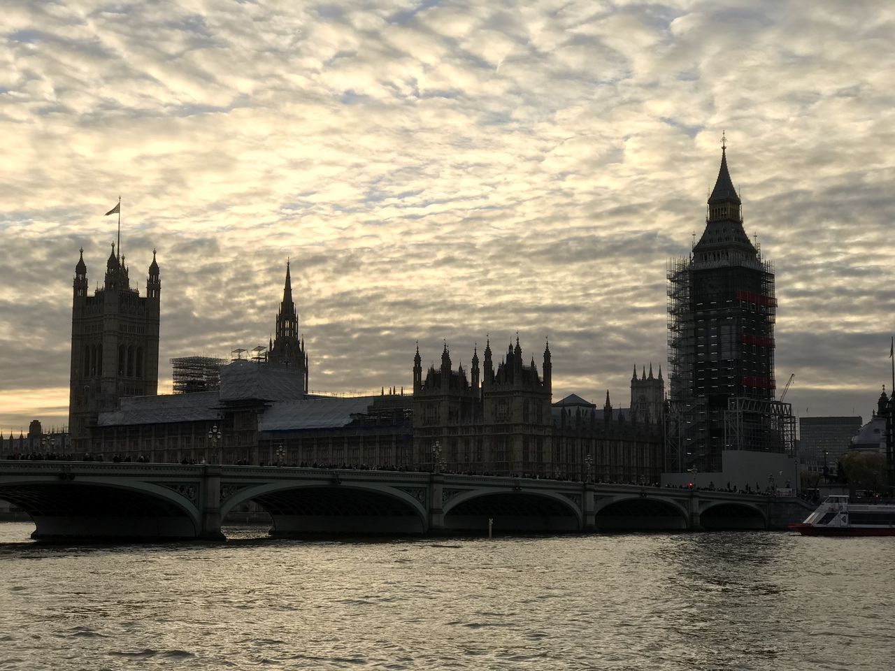 VIEW OF BUILDINGS AGAINST CLOUDY SKY