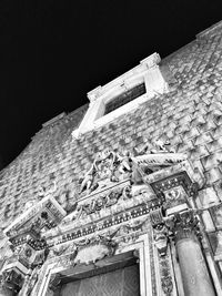 Low angle view of building against sky at night