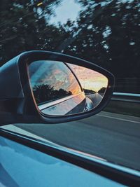 Reflection of car on side-view mirror