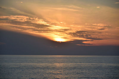 View of calm sea at sunset