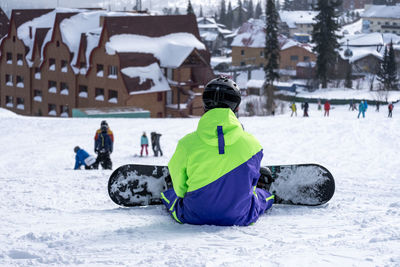 Man skiing on snow covered field