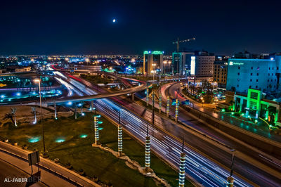 High angle view of light trails on road at night