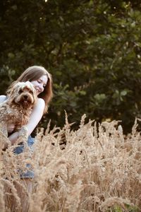 Portrait of dog on field