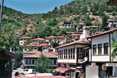 Houses in city against clear sky