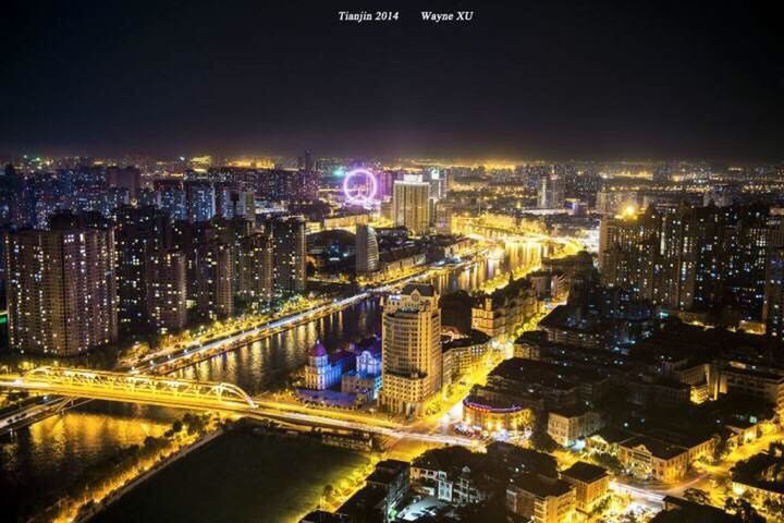 illuminated, night, city, cityscape, architecture, building exterior, built structure, high angle view, crowded, skyscraper, modern, city life, tower, capital cities, residential district, aerial view, tall - high, travel destinations, office building, sky