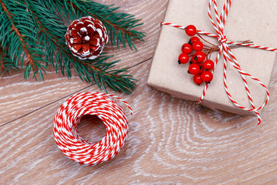 Close-up of christmas tree and gifts on table