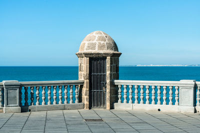 Scenic view of sea against clear blue sky