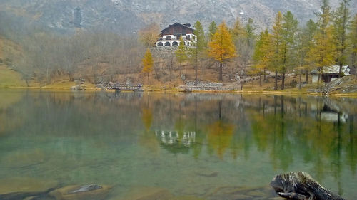 Scenic view of lake by building