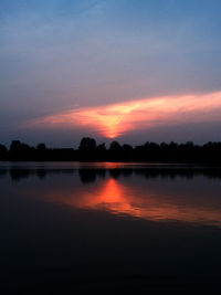 Scenic view of lake against romantic sky at sunset