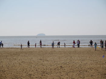 Group of people on calm beach