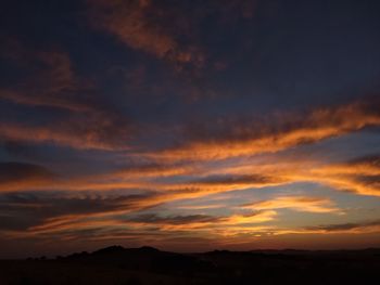 Scenic view of dramatic sky during sunset