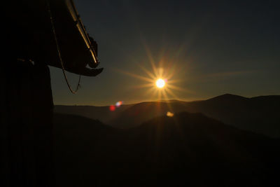 Silhouette mountain against sky during sunset