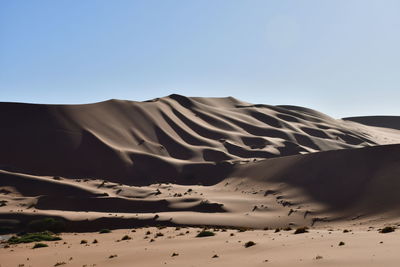 Low angle view of sand dune