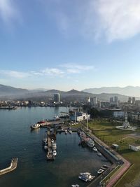 High angle view of harbor and buildings in city