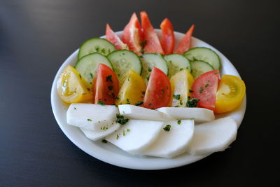 Close-up of fruit salad served on table