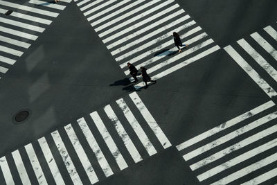 High angle view of people crossing street