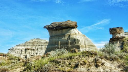 Low angle view of rock formation against sky